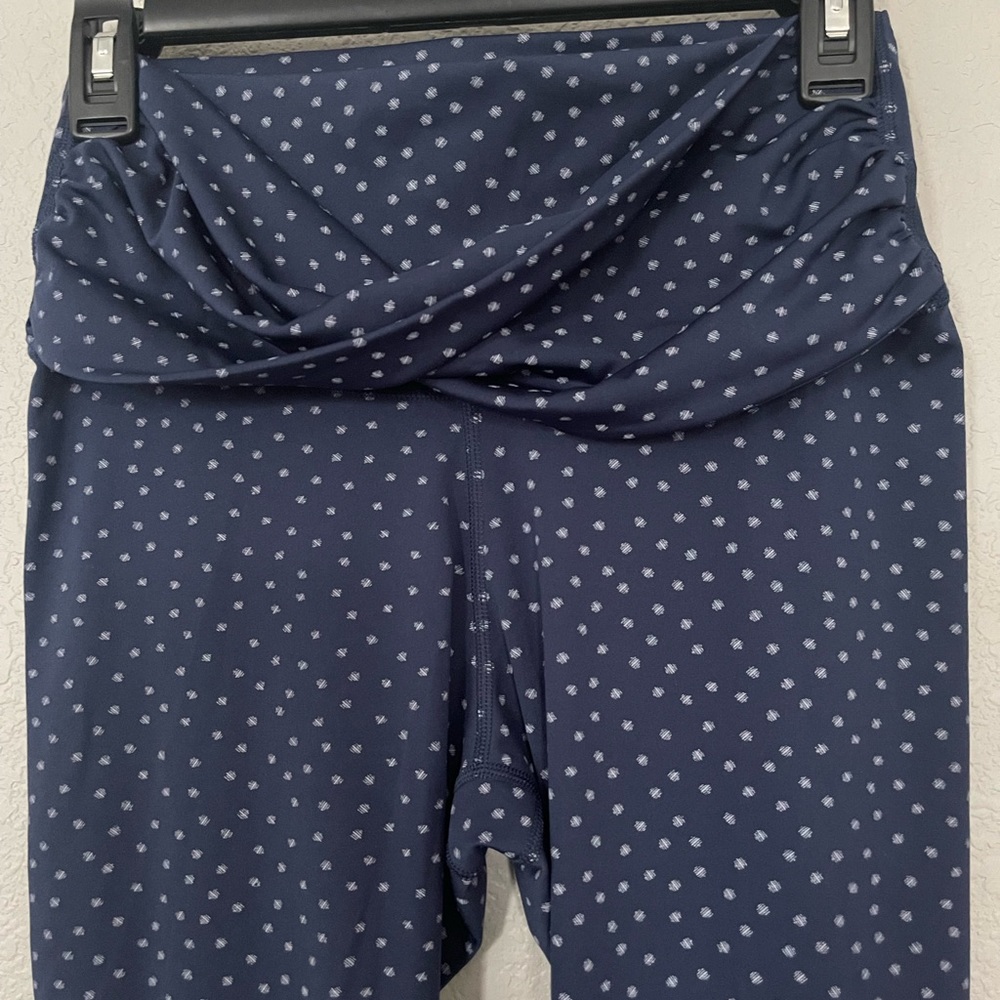 Nike Yoga pants. Size Medium. 7/8 length. Dark blue colored with white designs
